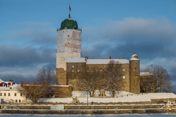 At the ancient Vyborg castle on a sunny February evening. Leningrad region, Russia