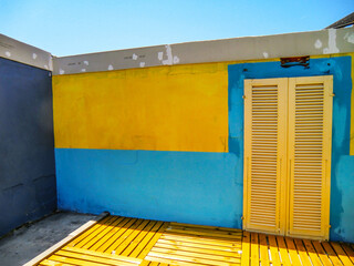 Colorful doors and windows of the restaurant pizzeria inside the swimming pool center in Olmedo,...