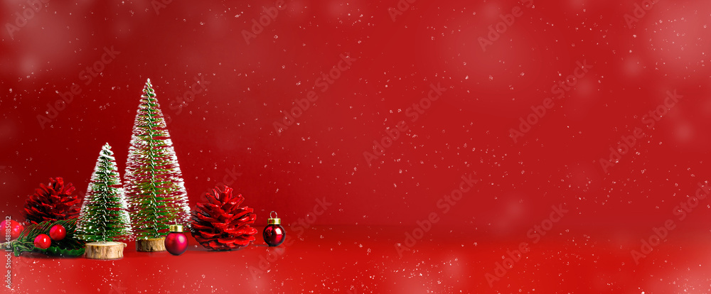 Poster Merry Christmas and happy new year snow falling  red background with xmas tree and pine cone on.Banner mockup space for display of product or design or text