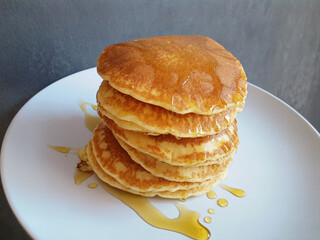 pancakes piled with melted honey
