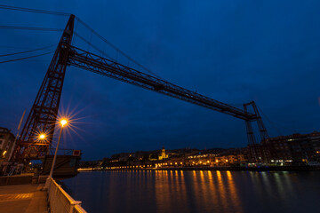 Fototapeta na wymiar Vizcaya Bridge, Portugalete Bridge, suspension bridge. The oldest ferry bridge in the world. It joins the towns of Guecho and Portugalete. It is a historic-artistic monument and a World Heritage Site.