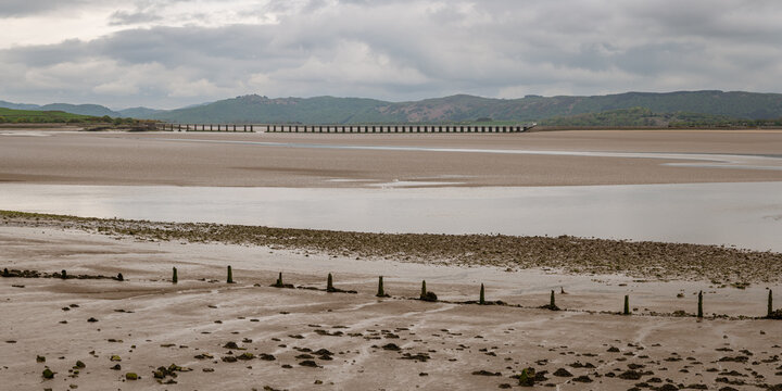 Low tide at Morecambe Bay with Leven Viaduct in the background, seen from Canal Foot, Cumbria, England, UK