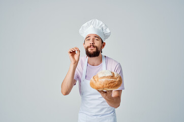 man in chef's uniform cooking food baking cooking