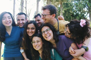 Team  portrait of healthcare worker friends / intern doctors / medical students together & smiling happy *3