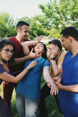 Funny team portrait of healthcare workers / intern doctors / medical students fainting and caring