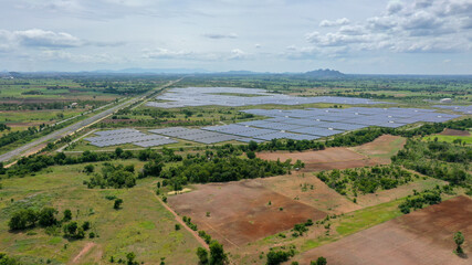 Fototapeta na wymiar Solar energy farm. Aerial view of a solar farm in Asia.