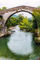 Roman bridge of medieval origin over the Sella river in the city of Cangas de Onis, Asturias, Spain.