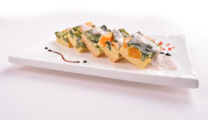 steamed egg pudding with pumpkin and vegetables with white coconut sauce in white background for Christmas festival menu