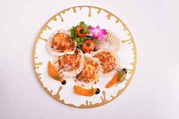 bbq baked cheese fresh scallop on shell seafood canapés with nice plating in white background for Christmas festival menu