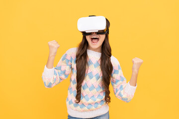 Obraz na płótnie Canvas child in virtual reality goggles. modern wireless technology. childhood development. happy teen girl