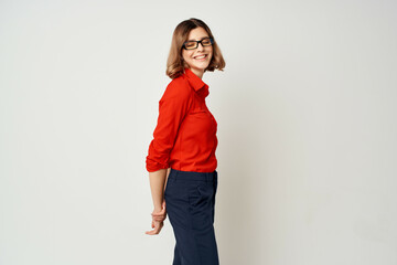 woman in business suit wearing glasses posing office official