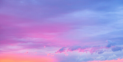 Sunset sky. Texture of bright evening sky during sunset. Dramatic blue and orange, pink colorful clouds at twilight time. Abstract weather nature background.