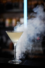 the exotic alcoholic cocktail with the smoke