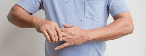 Man hand with numbness and pain in the fingers, pain, and tingling in the nerve endings. which is a...