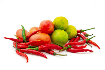 Fresh mix vegetables isolated on a white background, Red chilies, tomato and green lemon. Group of...
