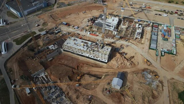 Construction site for a new city block. Construction work is underway. Aerial photography.