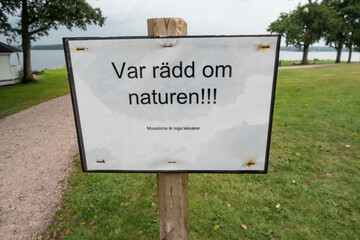 Hofsnas, Sweden A sign on a lawn in Swedish saying: 