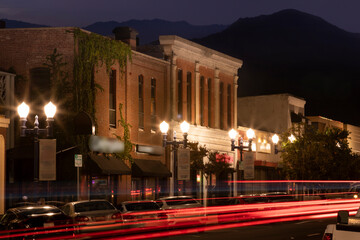 Night time view of the downtown area of Azusa, California, USA. - obrazy, fototapety, plakaty