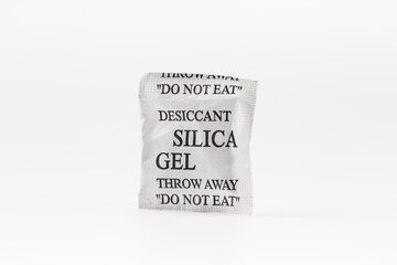Silica gel in white paper package on isolated white background.