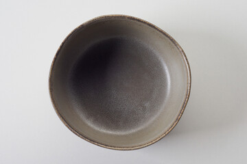 Gray ceramic dishware on white background