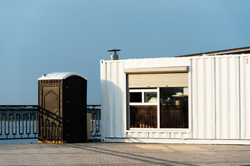 A metal container converted into a living space. Portable house with dry closet and heating system....