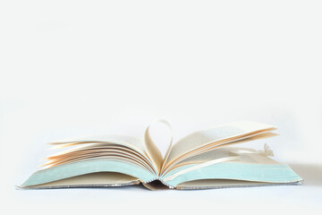 open book on white background. Reading,literature,education,library,home office, back to school concept,high key, large free copy space