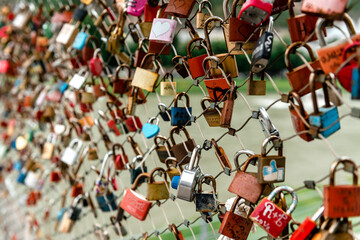 Closeup of love lockers at famous bridge Makartsteg in Salzburg, Austria. Padlocks of love on a bridge.