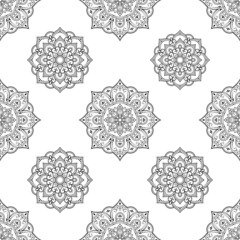 Seamless decorative ornament in ethnic oriental style. Circular pattern in form of mandala and flower for Henna, Mehndi, tattoo, decoration. Doodle outline hand draw vector illustration.