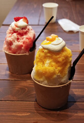 Nagano, Japan, 2021-31-07 , Cup of Kakigori, a traditional japanese shaved ice served with syrups.