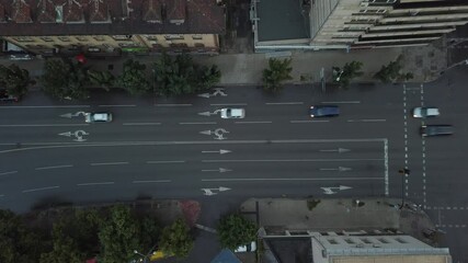 An overhead view of an urban street with active traffic in 4K