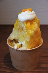 Nagano, Japan, 2021-31-07 , Cup of Kakigori, a traditional japanese shaved ice served with syrups.