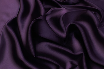 Silk satin fabric. Eggplant color. Texture, background, pattern.