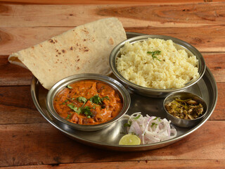 Veg Thali from an indian cuisine, food platter consists variety of veggies, jeera rice, roti, dal...