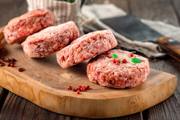 Frozen spicy beef patties with pepper. Home-made minced meat cutlet