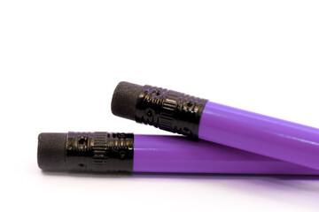 Two Violet Pencils on white background. stationery. Office tool. Back to school.