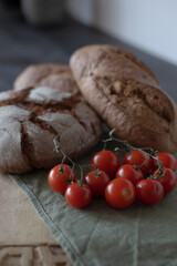 Freshly baked bread with tomatoes on the table