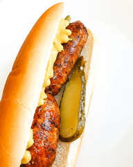 hot dog with mustard and pickle