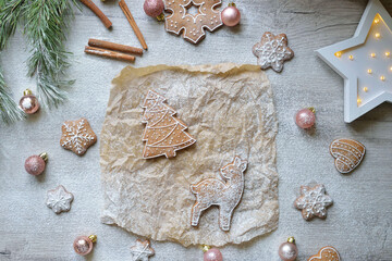 set of Christmas gingerbread herringbone and deer on a table with New Year's decor. christmas baking concept.