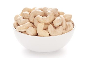 Close-up Organic dry fruit cashew nut (Anacardium occidentale)  in white ceramic  bowl on white...