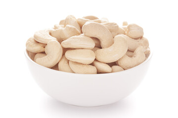 Close-up Organic dry fruit cashew nut (Anacardium occidentale)  in white ceramic  bowl on white background