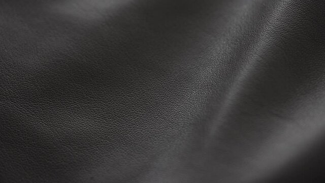 Slow motion handheld shot of soft gray brown leather closeup