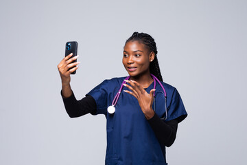 African doctor woman doing selfie shot on mobile phone make video call.