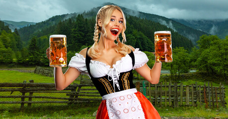 Oktoberfest girl waitress with beer. Woman wearing a traditional Bavarian or german dirndl on...