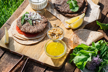 Spicy lamb kebab patties served with mint dip, crunchy salad, pitta bread and raw red onions.
