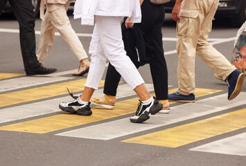 pedestrians walking on a crosswalk