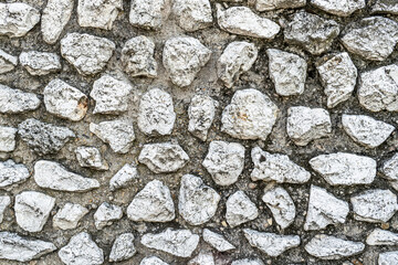 stone wall background closeup texture grey white old broken marble material rough pattern wallpaper backdrop