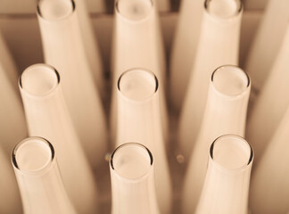 Rows of white flower vases. Glass product for sale