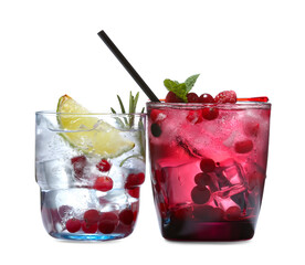 Glasses of fresh cocktails on white background