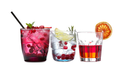 Glasses of fresh cocktails on white background