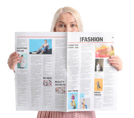 Mature woman with newspaper on white background